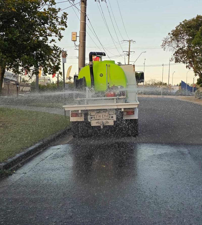 Laying water across the full width of a road