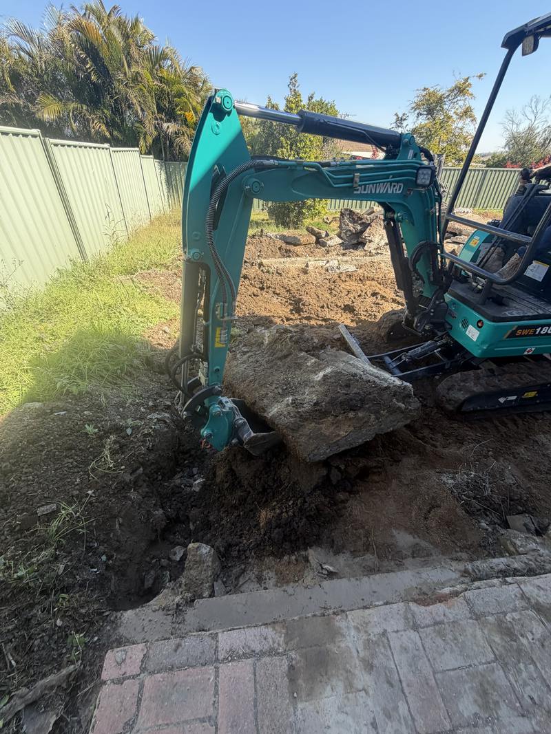 Rock lifted clear of a back yard