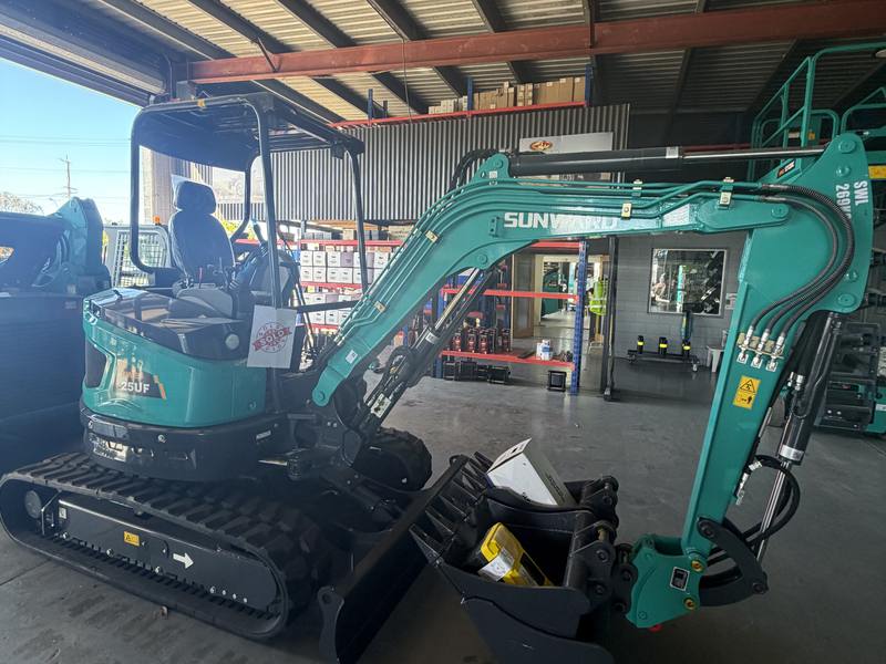 The Sunward SWE25UF 2.5-tonne excavator with its bucket set laid out beside the tracks